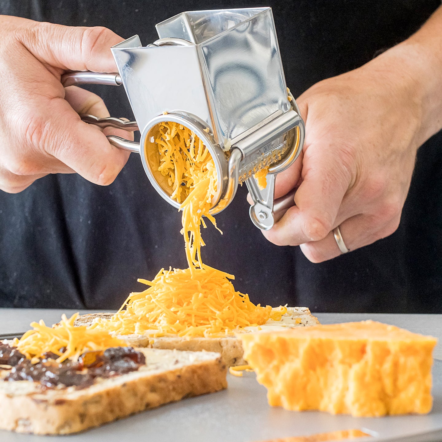 http://www.boroughkitchen.com/cdn/shop/files/stainless-steel-rotary-cheese-grater-mc-lifestyle-with-cheddar-cheese-borough-kitchen.jpg?v=1690468659