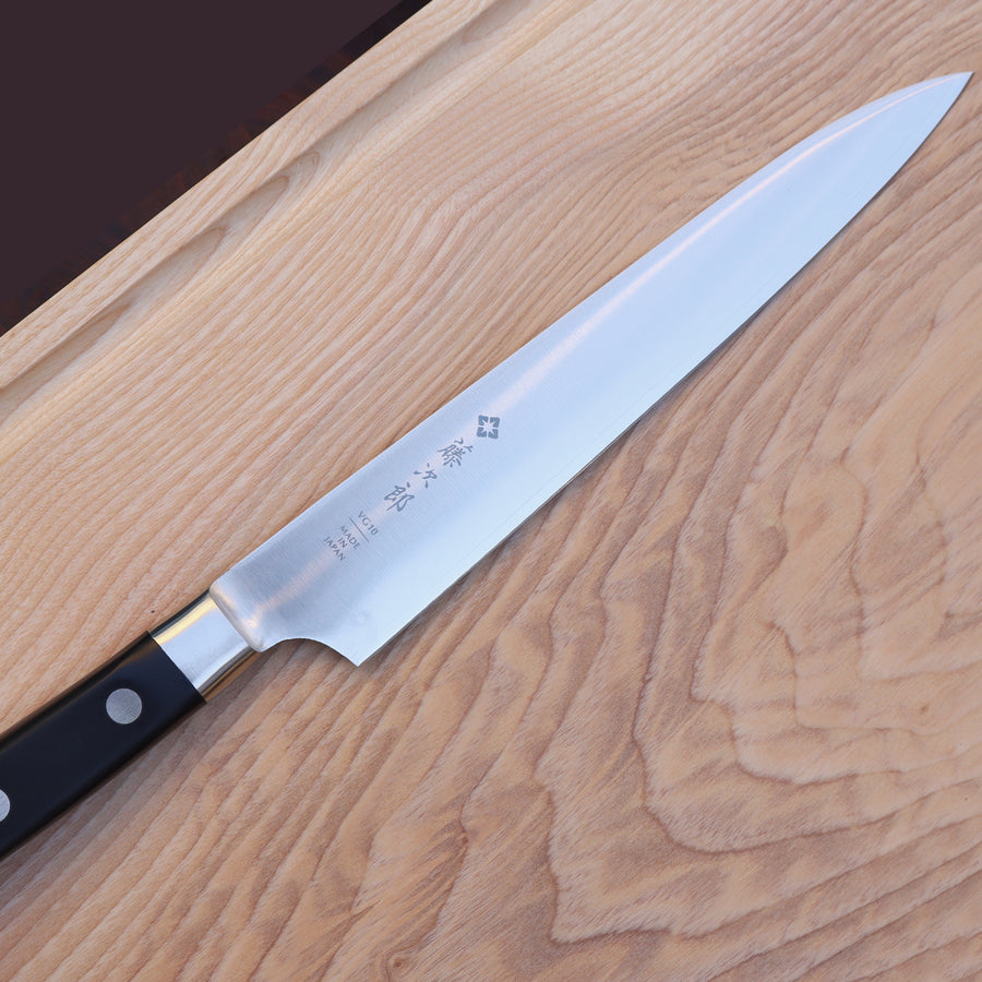 https://www.boroughkitchen.com/cdn/shop/files/tojiro-classic-carving-knife-mood-on-board-borough-kitchen_900x900.jpg?v=1694679619