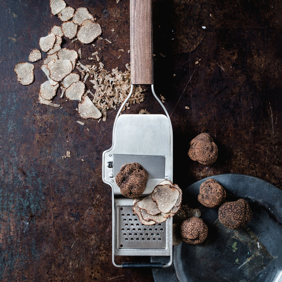 https://www.boroughkitchen.com/cdn/shop/products/microplane-master-series-truffle-slice-grater-mood-borough-kitchen_900x900.jpg?v=1661255919