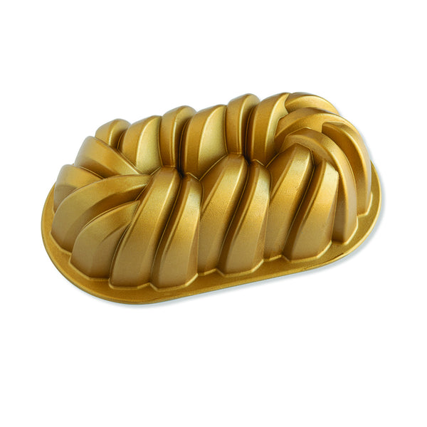 https://www.boroughkitchen.com/cdn/shop/products/nordicware-braided-loaf-pan-gold-borough-kitchen_grande.jpg?v=1659543147